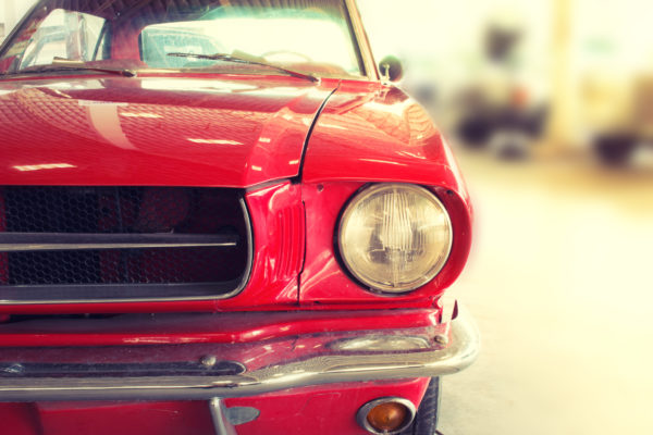 Close Up of Front of a Red Vintage Car